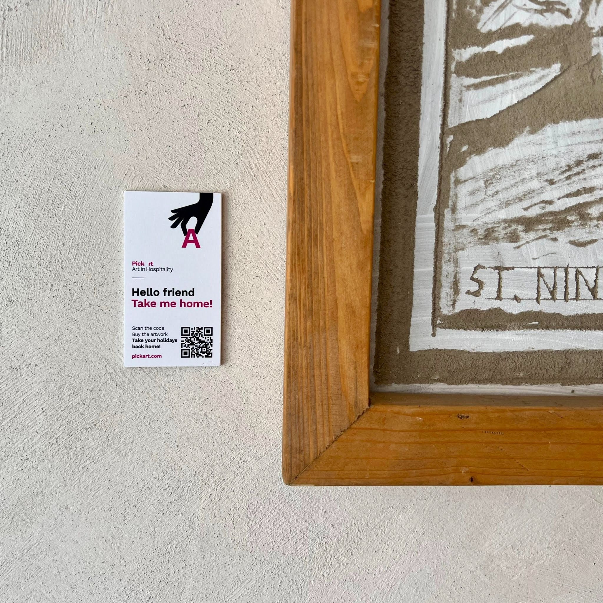 Curated original artworks rotating on a venue wall as part of the PickArt consignment model