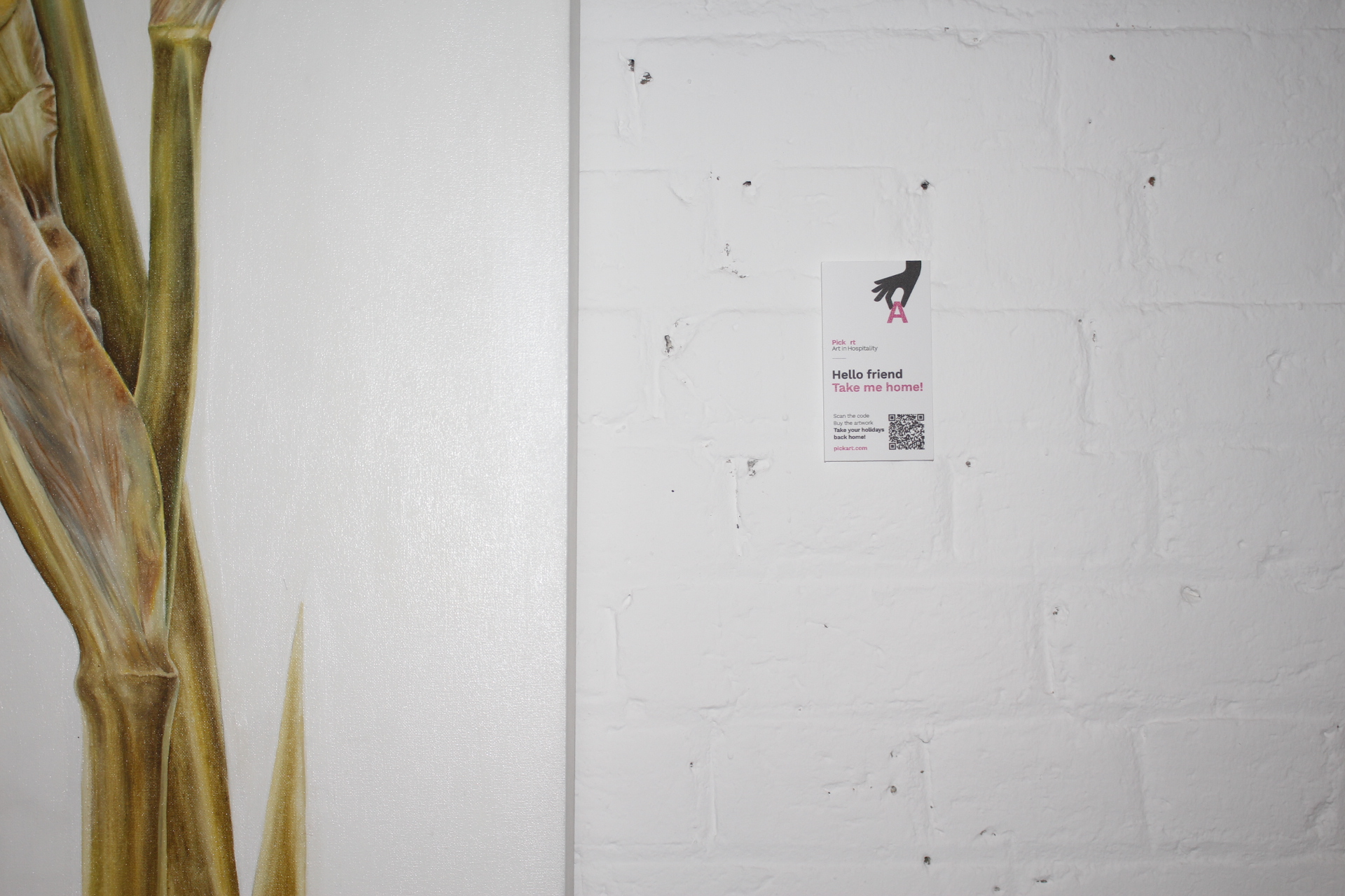 A guest scanning a QR code next to an artwork to learn more
